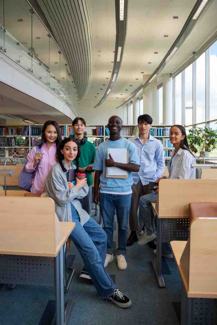 Smiley students in a library
