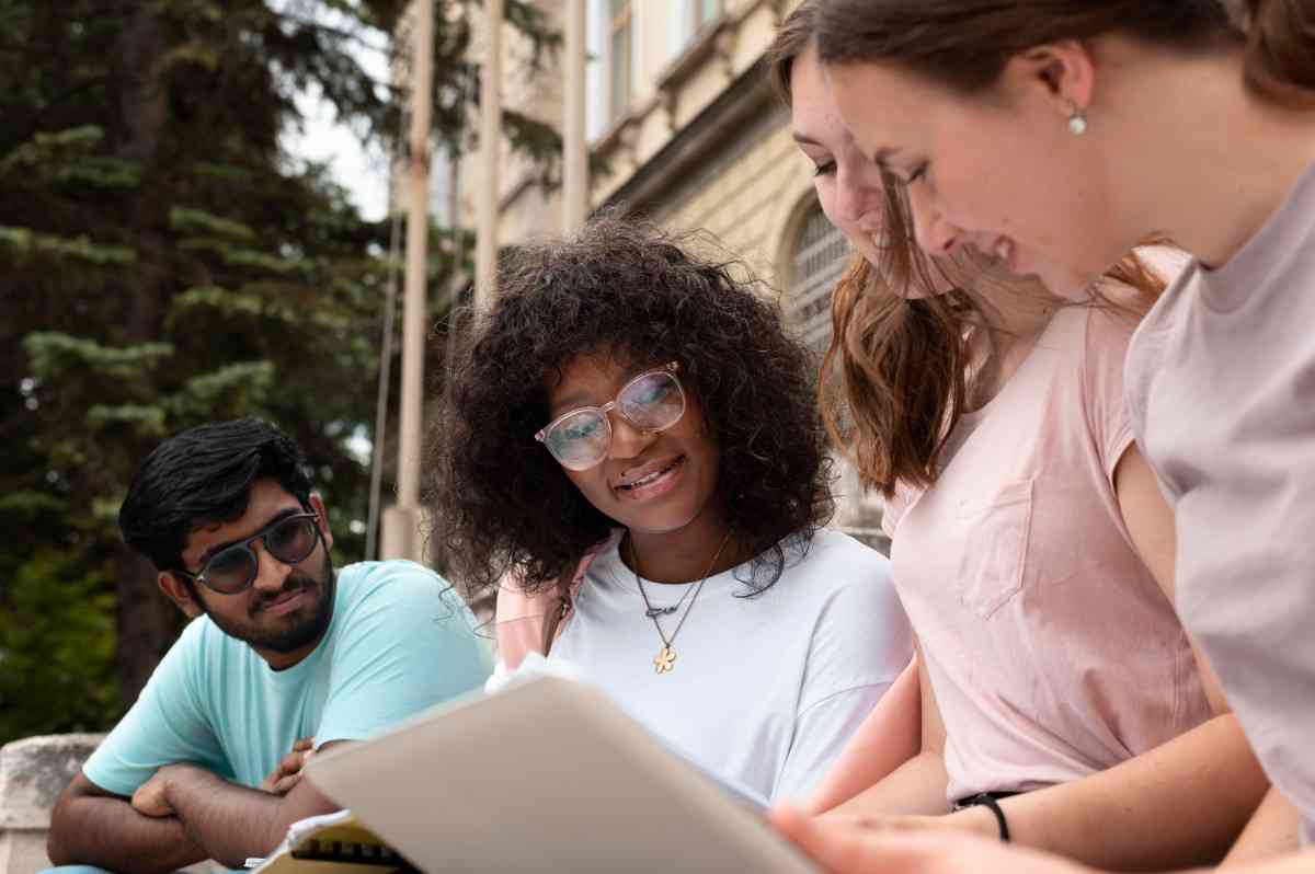 Young colleagues studying together in college