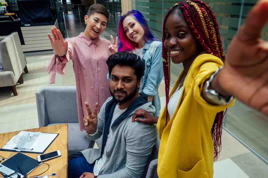 Multi-racial business group taking a selfie together